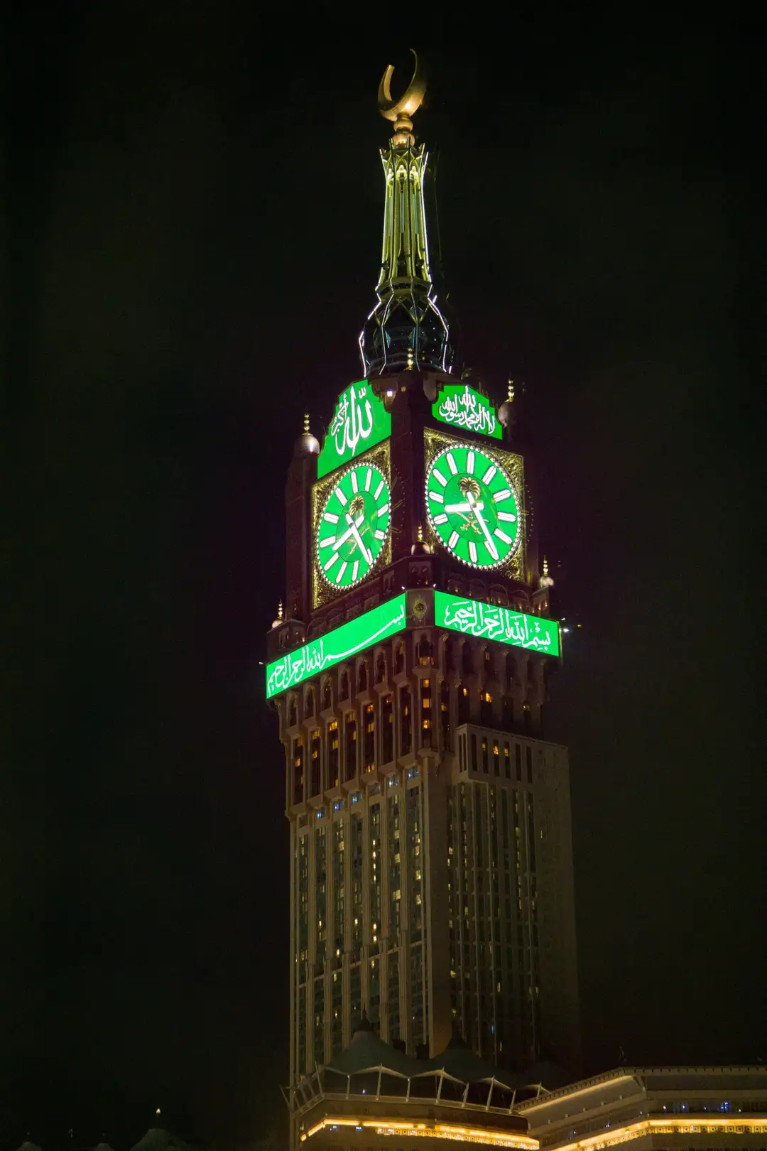 The Makkah Royal Clock Tower lit green at night