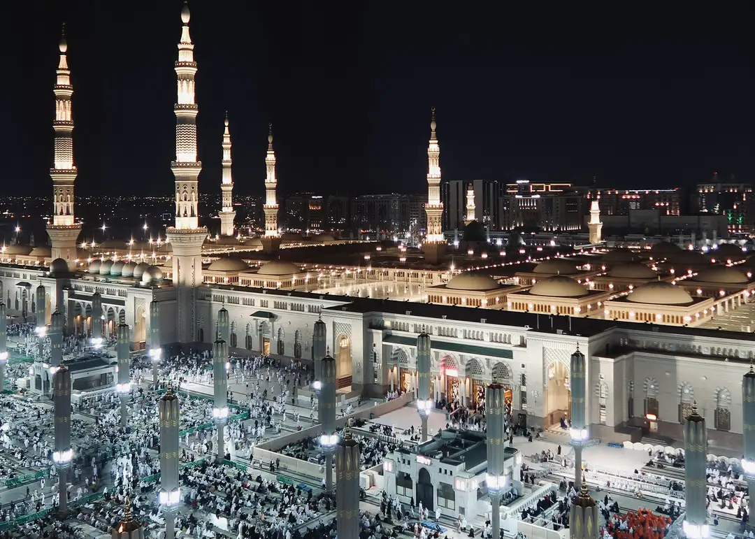 Masjid al-Haram and the towers of Makkah lit at night