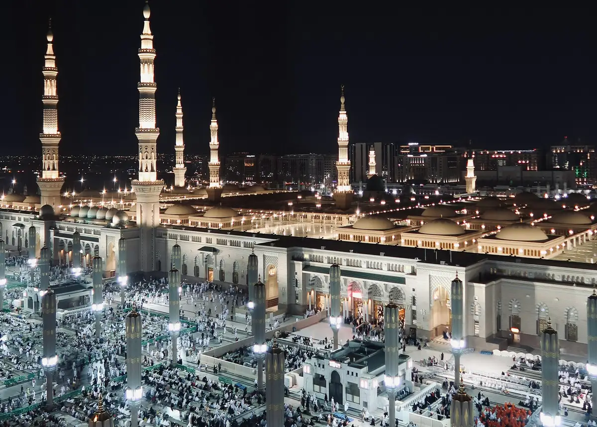 Masjid al-Haram and the towers of Makkah lit at night