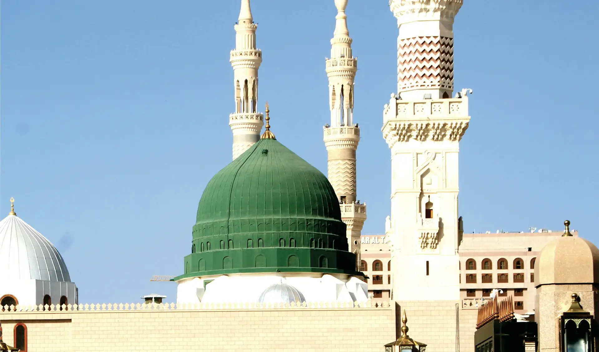 The Green Dome of the Prophet’s Mosque with its carved minarets rising beside it
