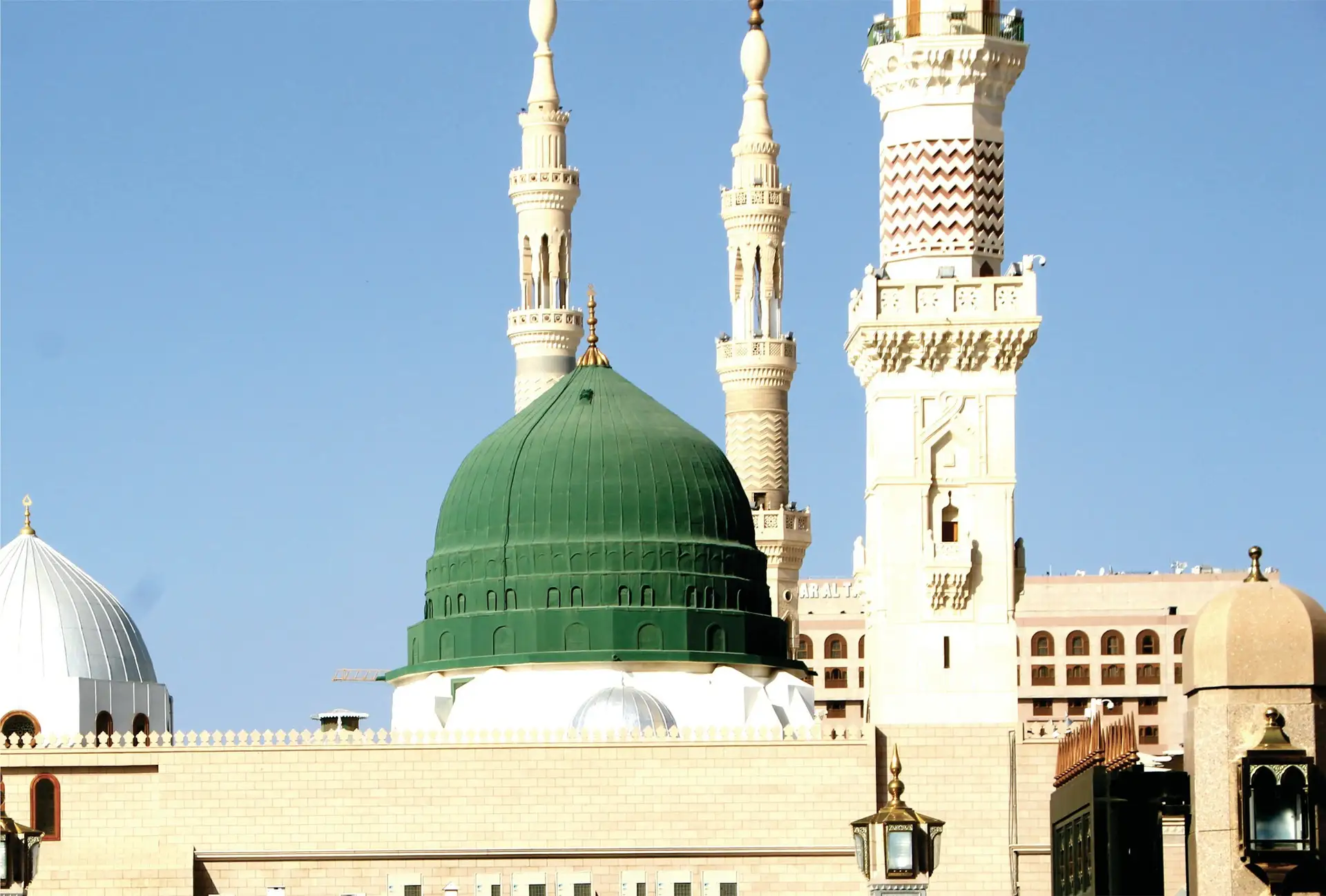 The Green Dome of the Prophet’s Mosque with its carved minarets rising beside it
