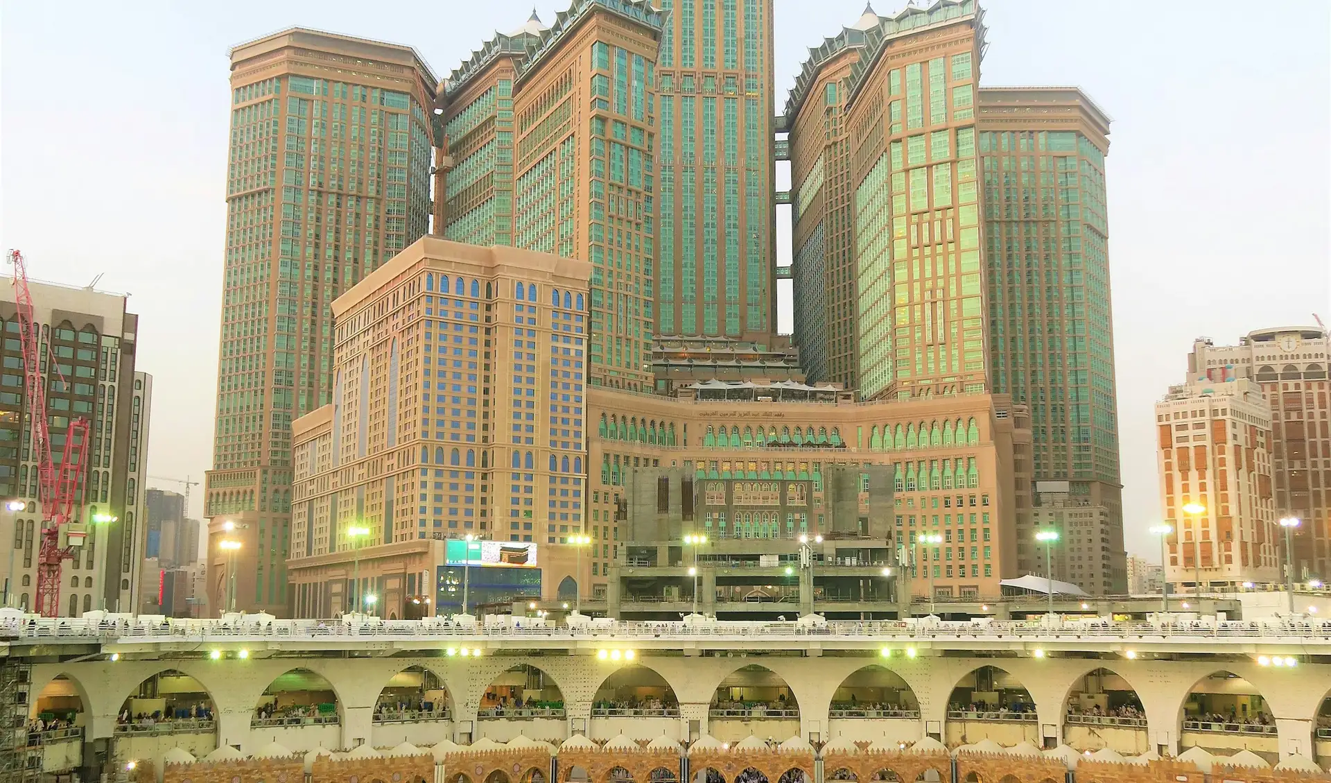 The Kaaba with the hotels of the clock tower rising behind the mosque