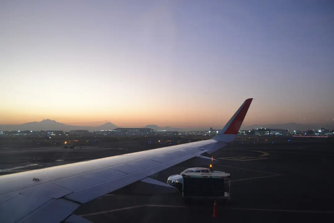 The wing of a plane seen through a cabin window on the way to Saudi Arabia