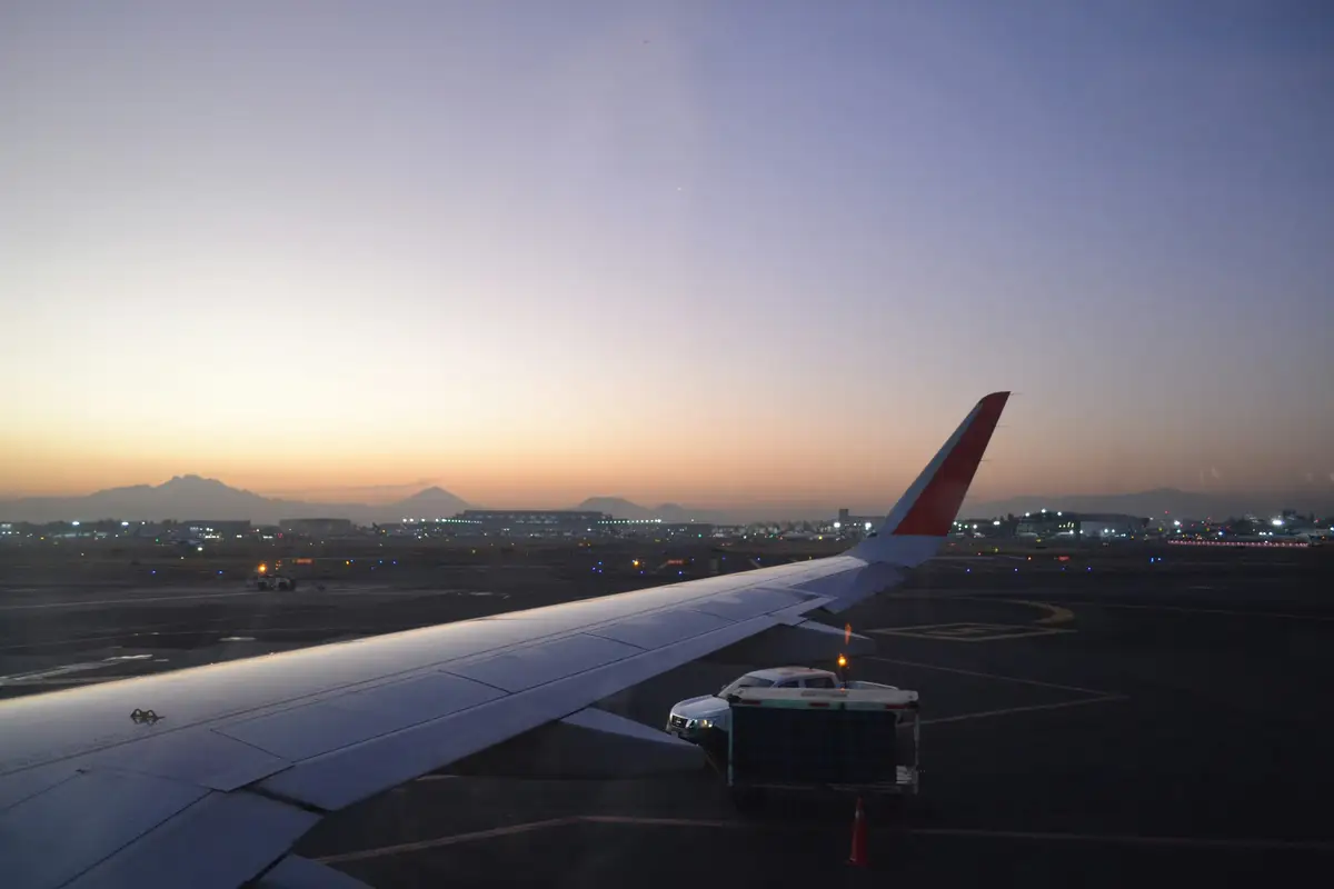 The wing of a plane seen through a cabin window on the way to Saudi Arabia